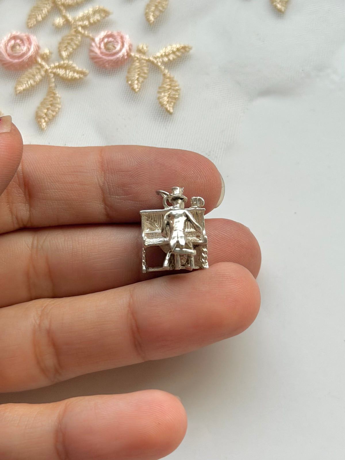 Moving Piano Man Silver Charm